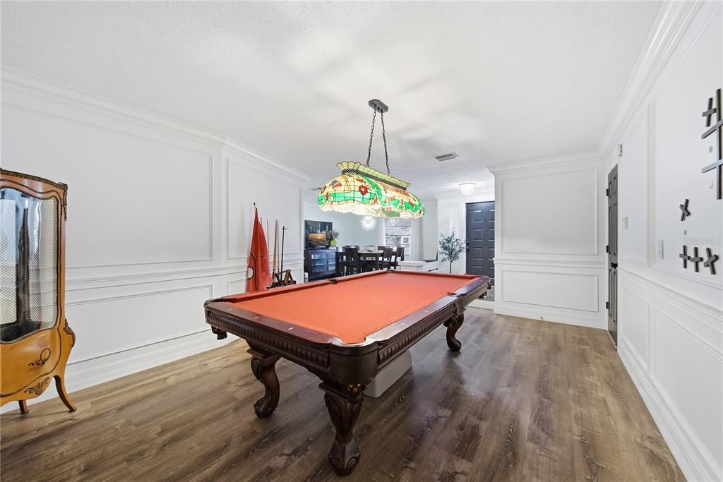 4602 Buckeye Road Tampa, FL 33624 - Photo 8 of 36 a room with pool table and windows