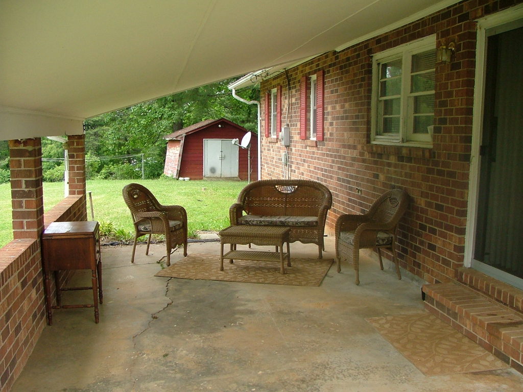 835 Falcon Ridge Road Rocky Mount, VA 24151 - Photo 2 of 8 a outdoor living space with furniture and a fireplace