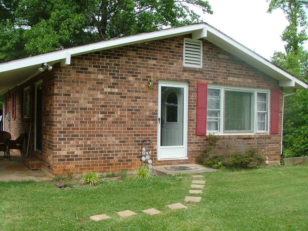 835 Falcon Ridge Road Rocky Mount, VA 24151 - Photo 3 of 8 a front view of a house with a garden