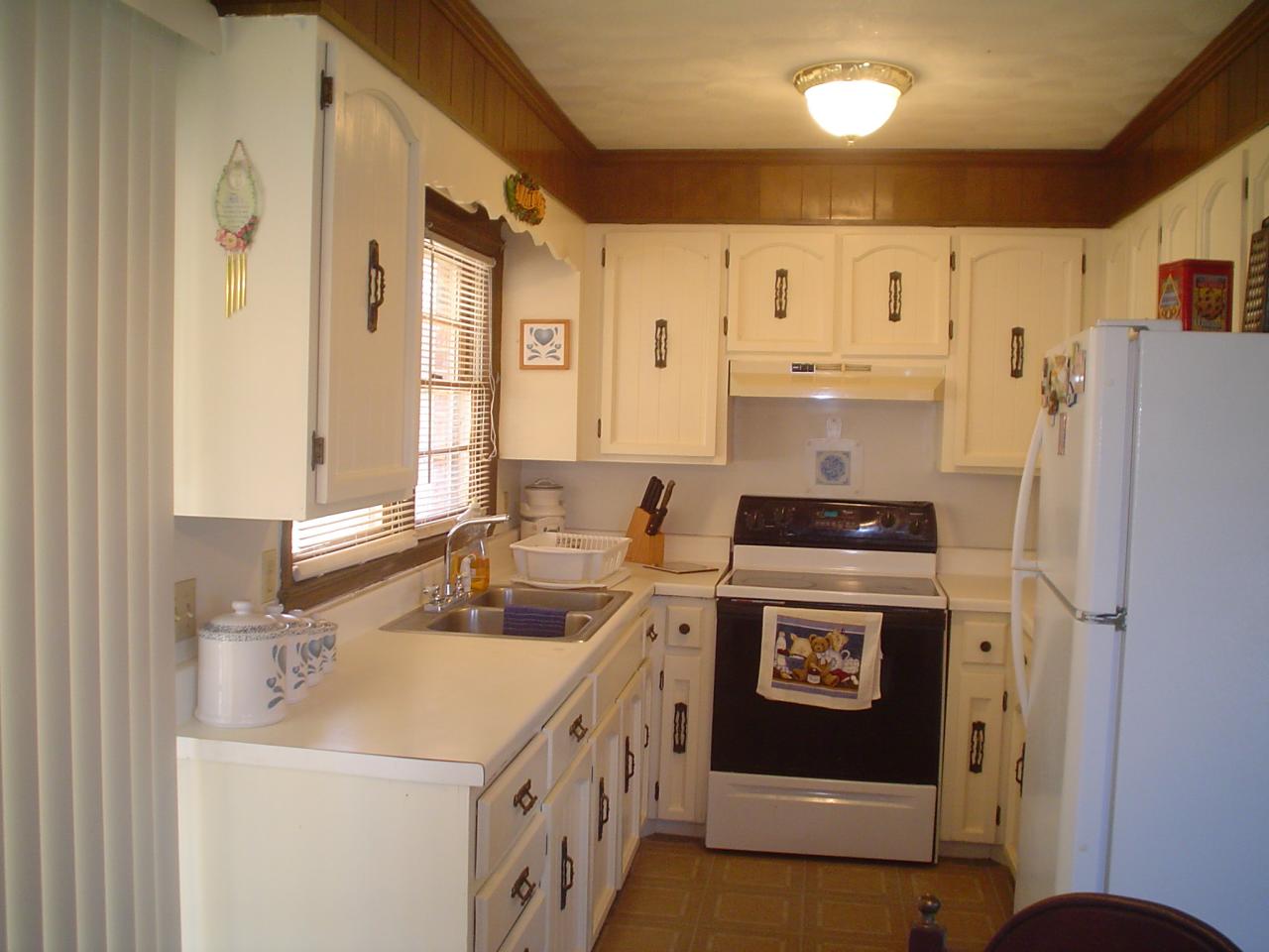 835 Falcon Ridge Road Rocky Mount, VA 24151 - Photo 5 of 8 a kitchen with a sink a stove and refrigerator