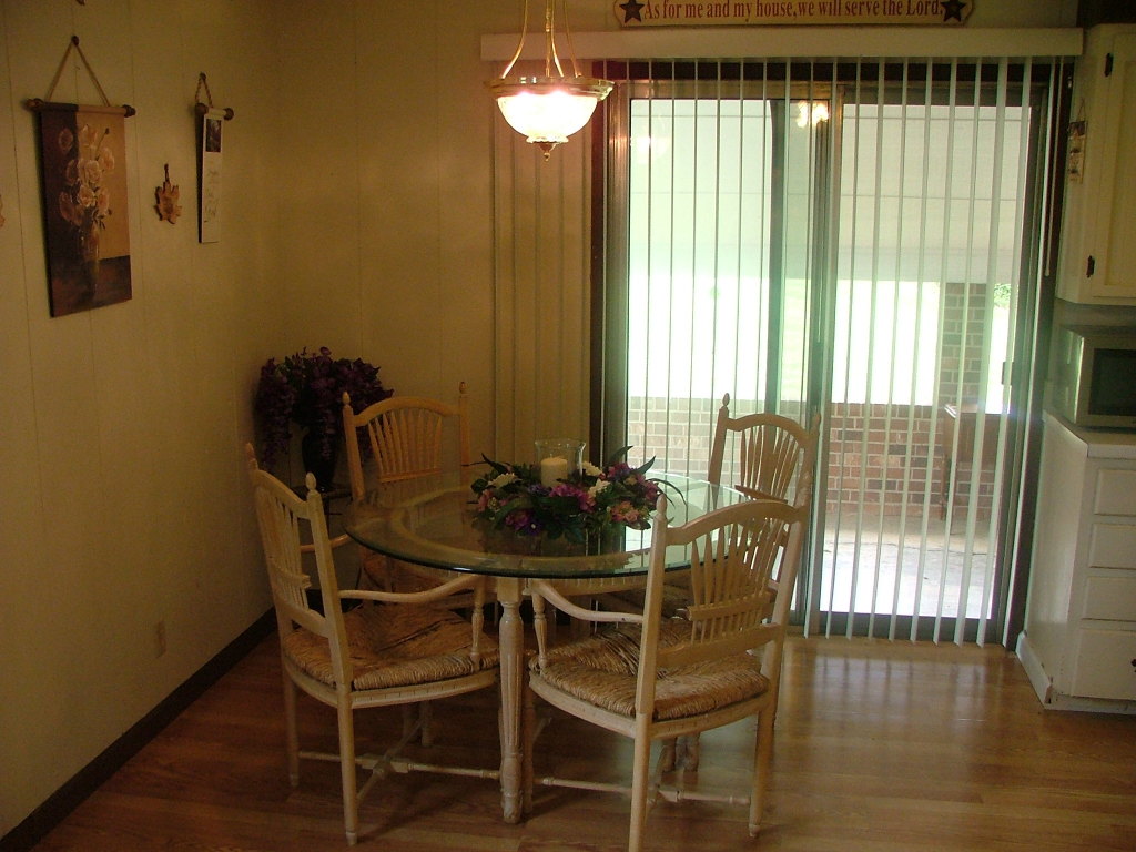 835 Falcon Ridge Road Rocky Mount, VA 24151 - Photo 6 of 8 a view of a dining room with furniture and wooden floor