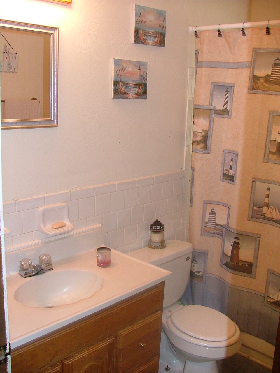 835 Falcon Ridge Road Rocky Mount, VA 24151 - Photo 7 of 8 a bathroom with a sink a toilet and a mirror