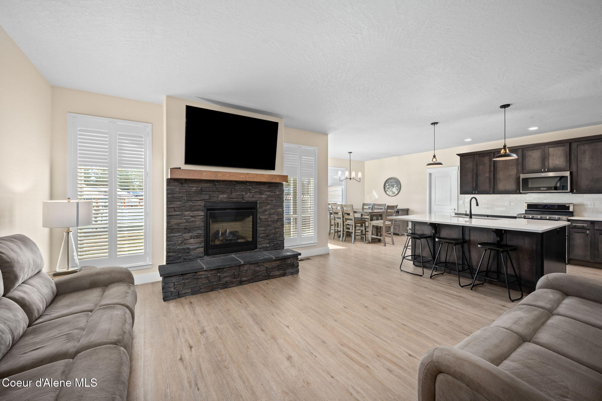 15289 North Liane Lane Rathdrum, ID 83858 - Photo 8 of 64 Gas fireplace w/rock surround