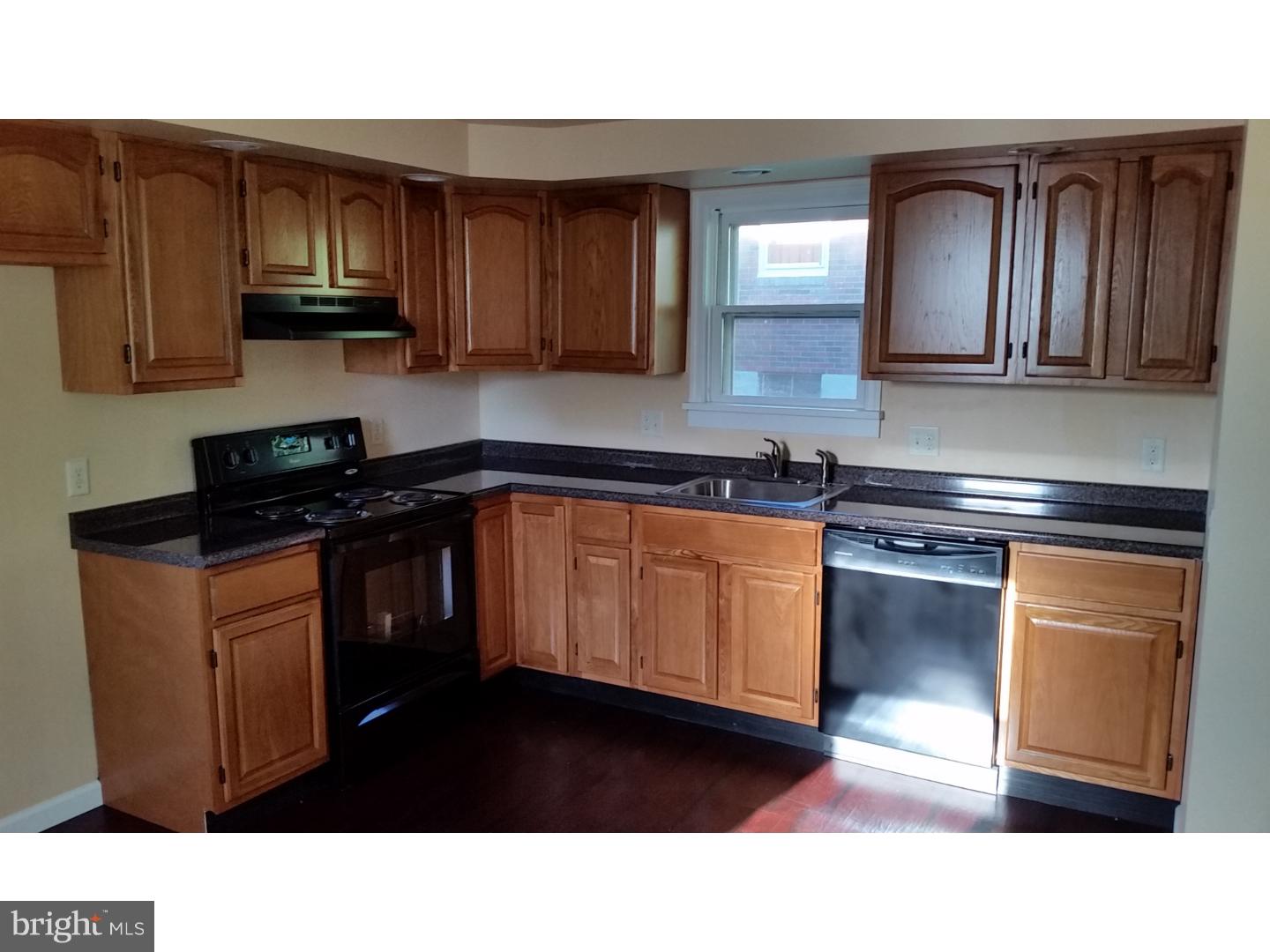 309 Reed Street Mohnton, PA 19540 - Photo 9 of 25 a kitchen with granite countertop wood cabinets stainless steel appliances and a sink