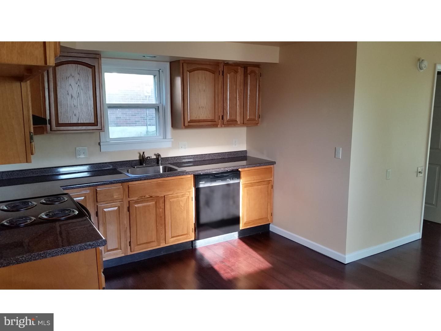 309 Reed Street Mohnton, PA 19540 - Photo 10 of 25 a kitchen with stainless steel appliances granite countertop a stove a sink and a refrigerator