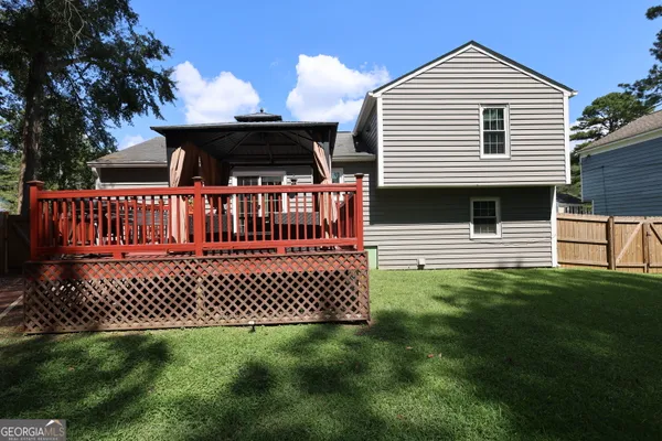 a front view of a house with a fence