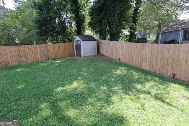 a garden covered with wooden fence
