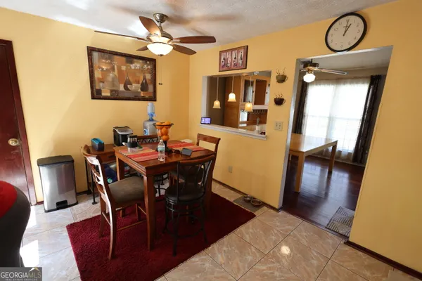 a view of a dining room with furniture and chandelier
