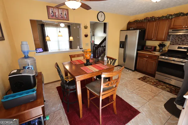 a view of a dining room with furniture and a table