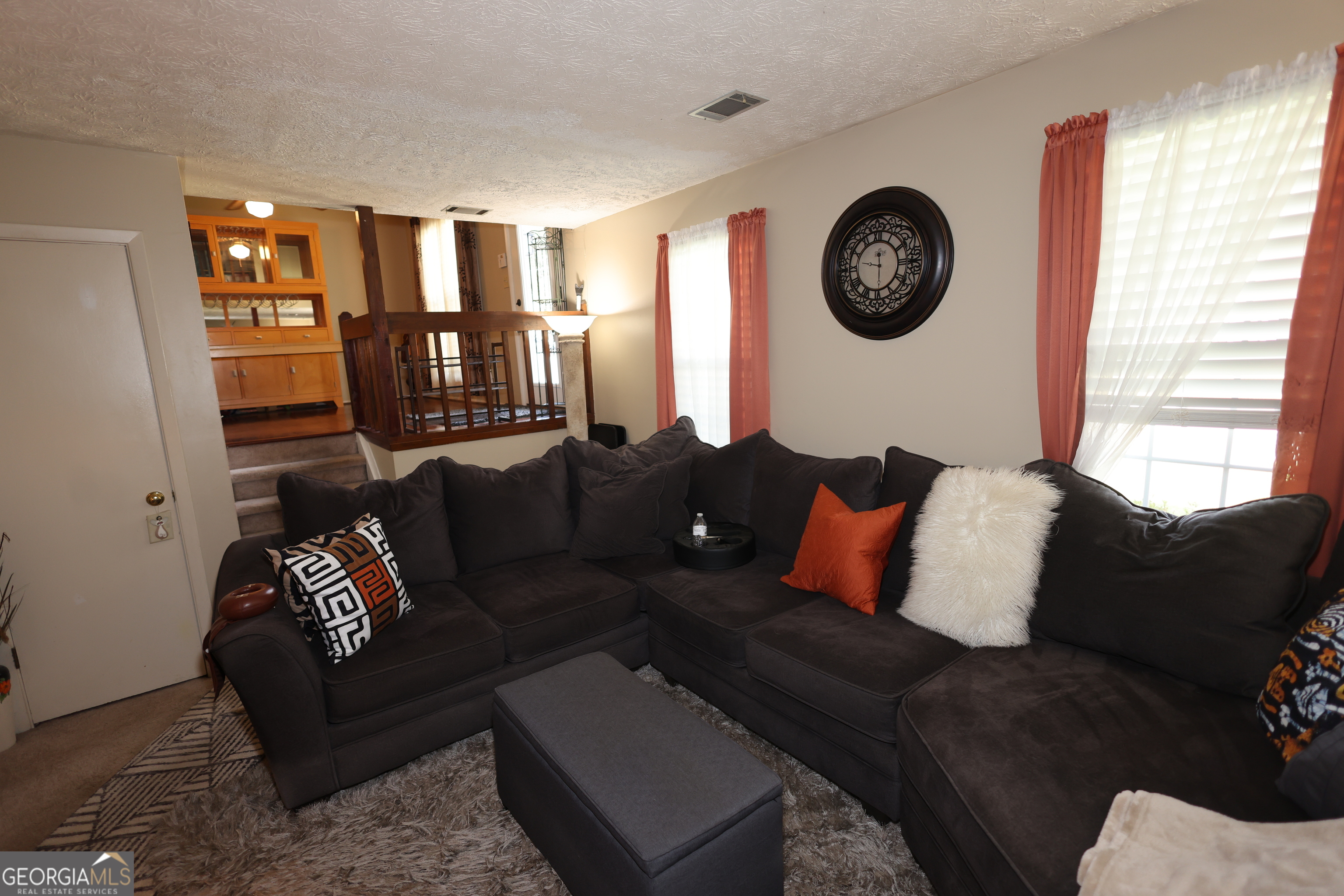 4577 Arborwalk Court Stone Mountain, GA 30083 - Photo 8 of 19 a living room with furniture and a large window