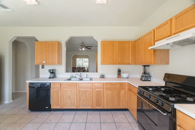 a spacious bathroom with a double vanity sink and a mirror