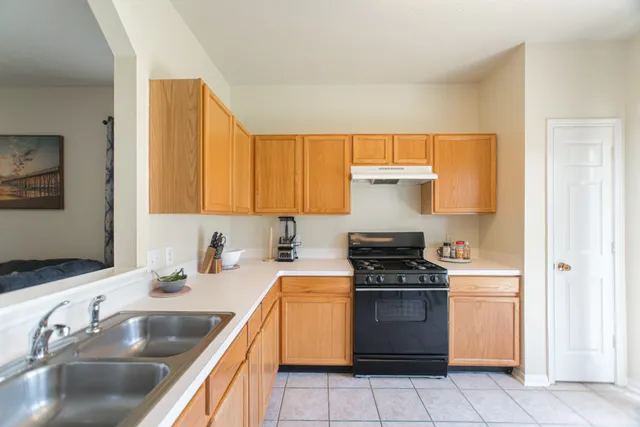 a view of a dining room with furniture and window