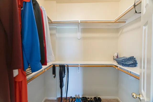 a bathroom with a sink a toilet and shower curtain