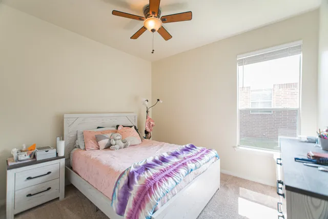 a view of a backyard with a garden and trees