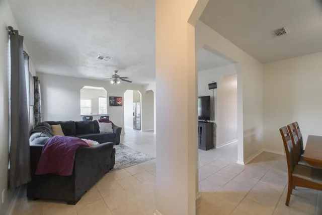 a living room with furniture and a fireplace