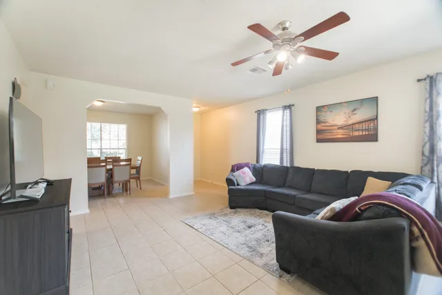 a living room with furniture and a window