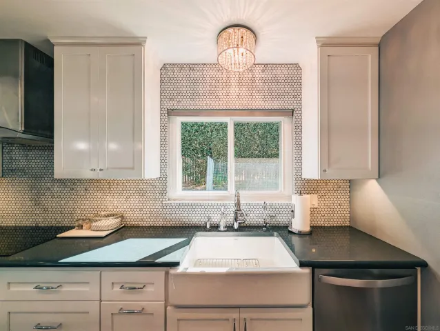 a kitchen with a sink and a window