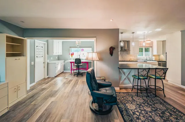 a view of a dining room with furniture window and wooden floor