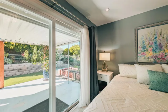 a spacious bathroom with a granite countertop sink mirror and a toilet