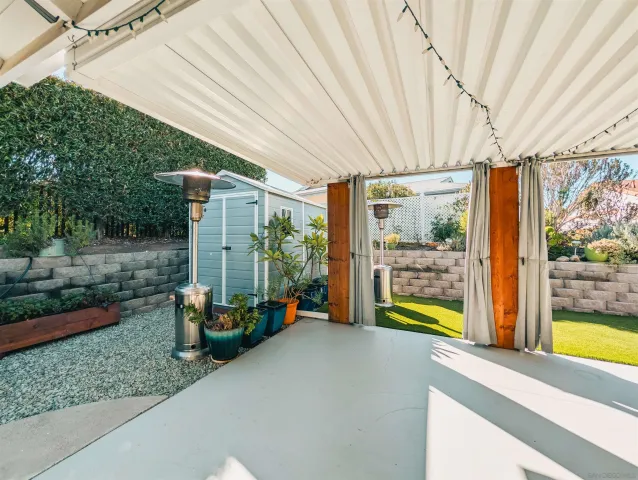 a front view of house with yard and trees in the background