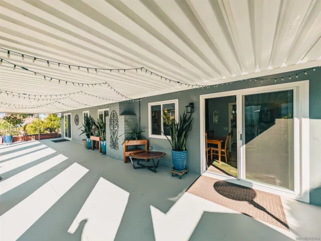 an aerial view of a house with a swimming pool yard and outdoor seating