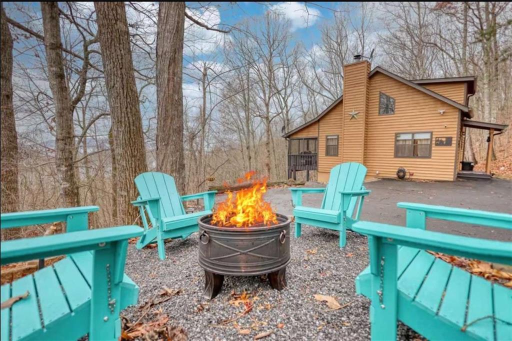 2531 Hunter Road Hiawassee, GA 30546 - Photo 2 of 30 a view of a backyard with plants and wooden fence