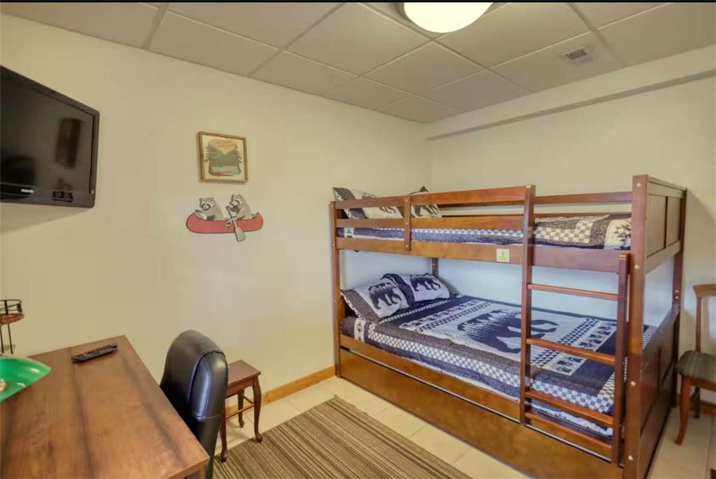 2531 Hunter Road Hiawassee, GA 30546 - Photo 21 of 30 a bedroom with a bed and wooden floor