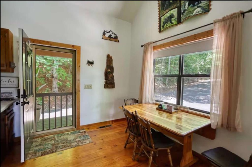 2531 Hunter Road Hiawassee, GA 30546 - Photo 24 of 30 a view of a dining room with furniture window and outside view
