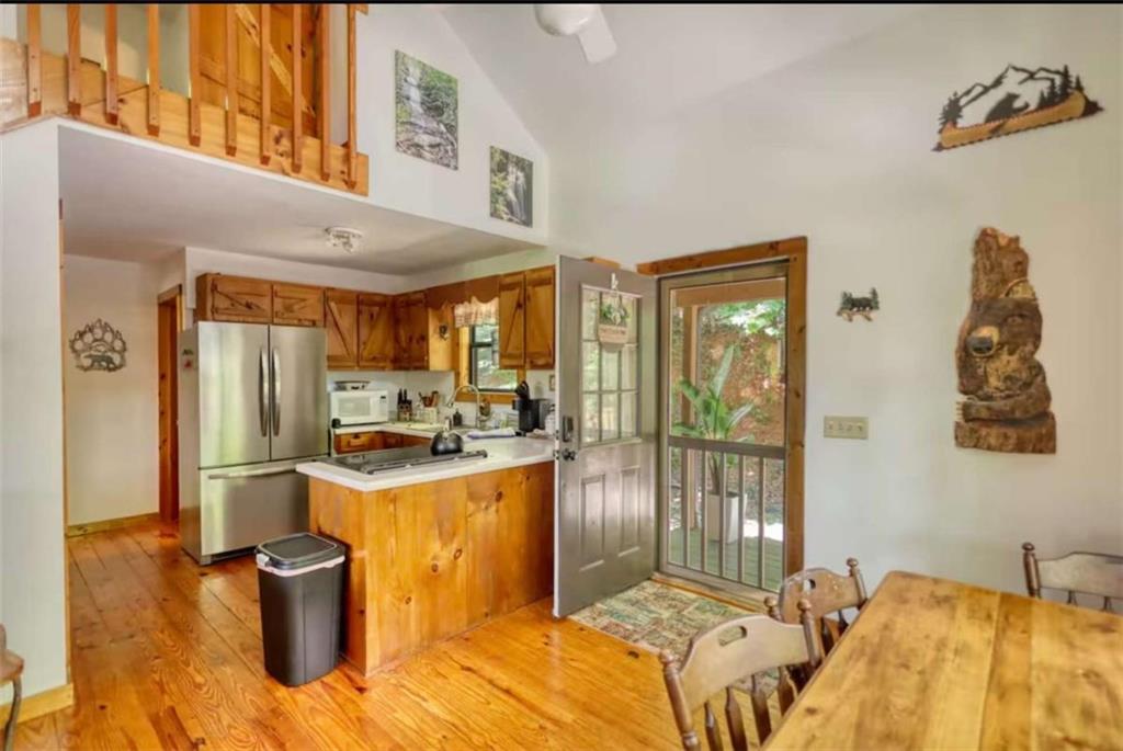 2531 Hunter Road Hiawassee, GA 30546 - Photo 26 of 30 a bedroom with a bed and wooden floor