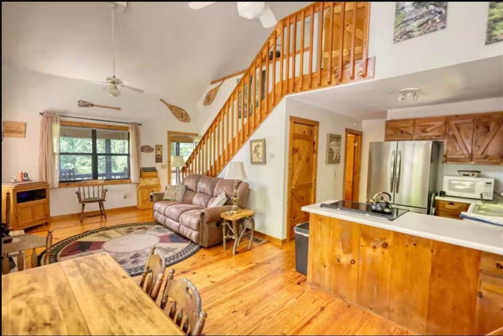 2531 Hunter Road Hiawassee, GA 30546 - Photo 28 of 30 a living room with furniture stove and a large window