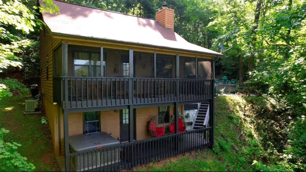 2531 Hunter Road Hiawassee, GA 30546 - Photo 5 of 30 a view of house with roof deck and entertaining space