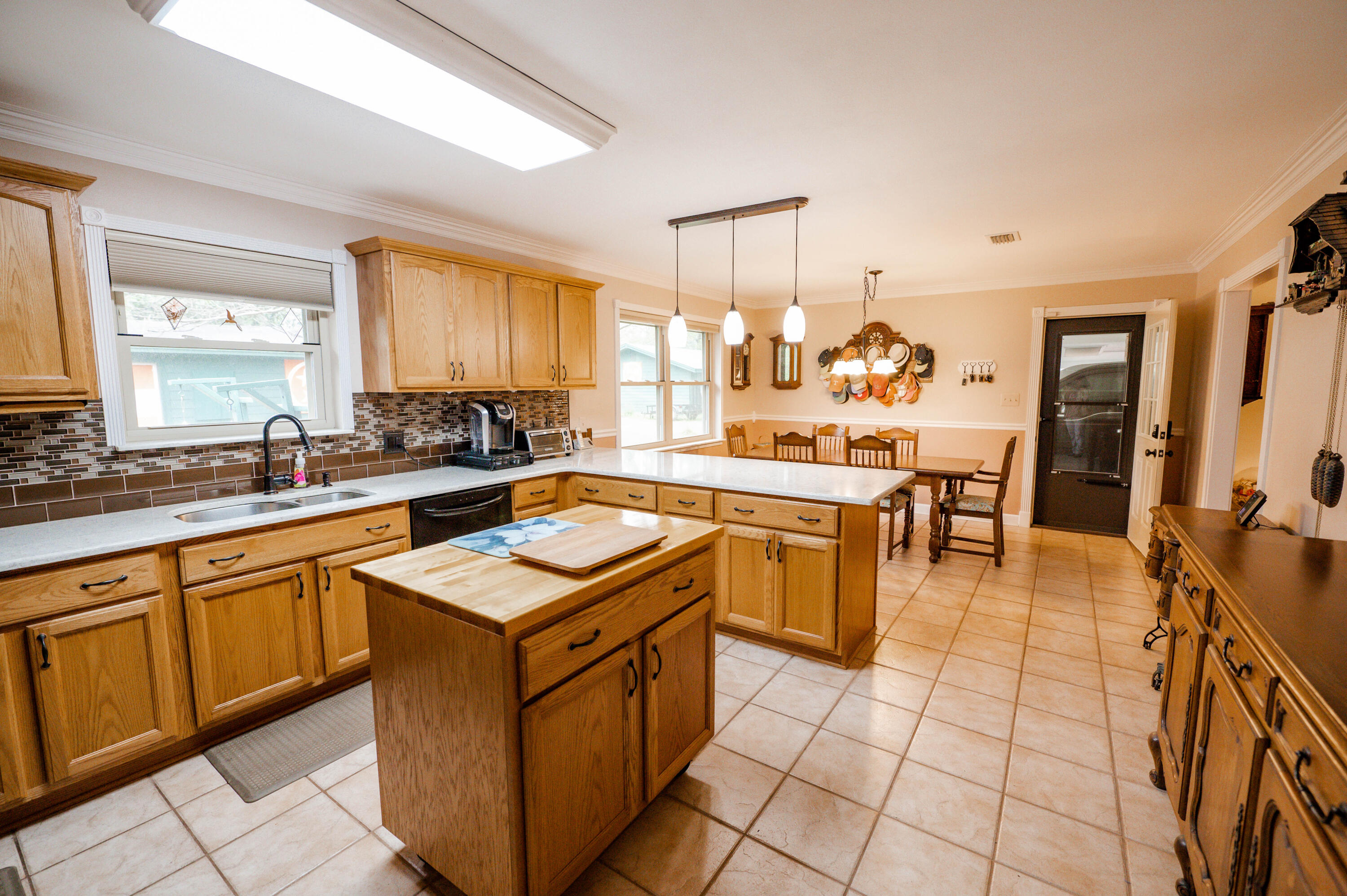 218 Howard Street Niceville, FL 32578 - Photo 11 of 36 a kitchen with a sink stove and cabinets