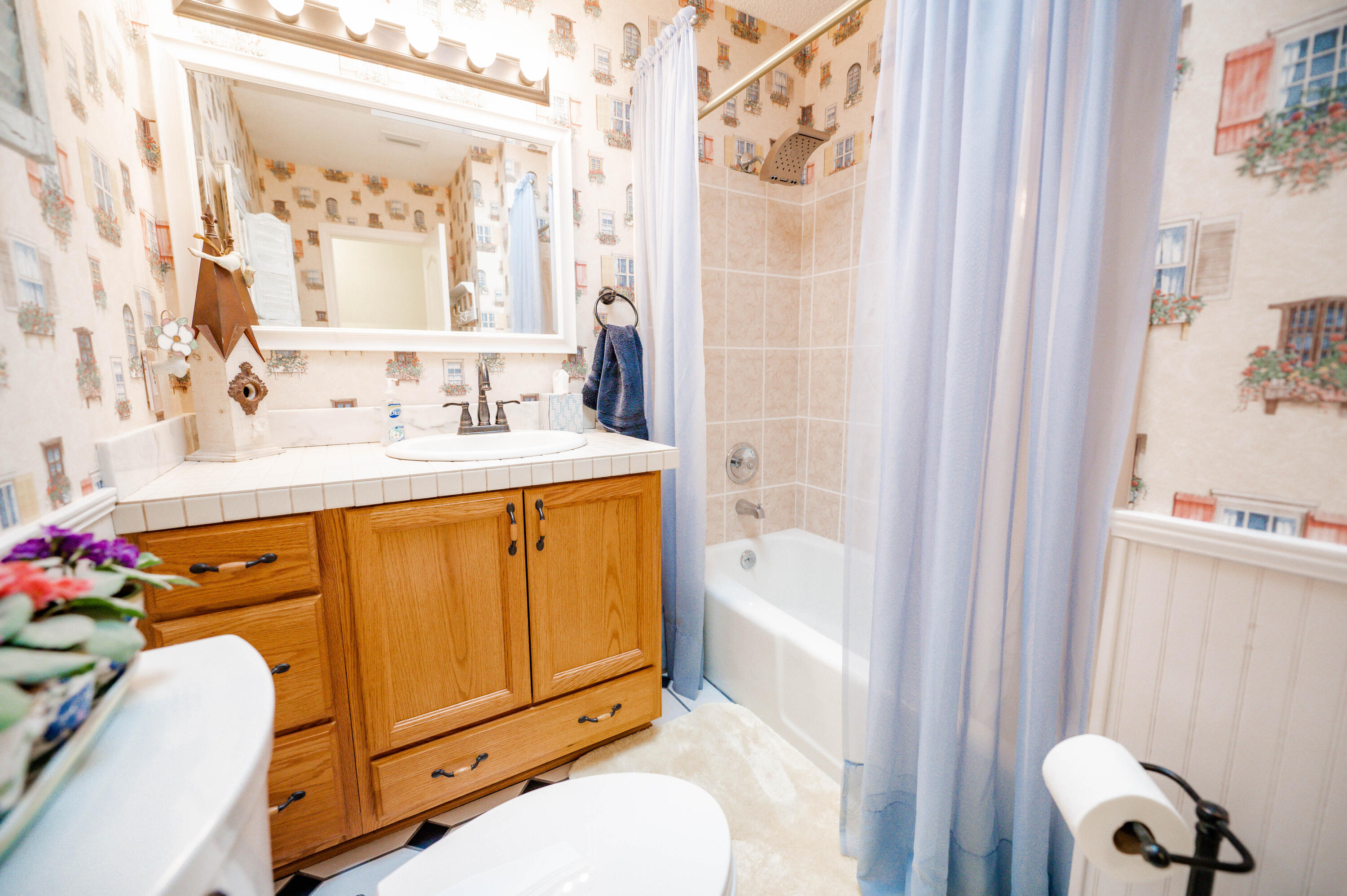 218 Howard Street Niceville, FL 32578 - Photo 17 of 36 a bathroom with a sink toilet and shower