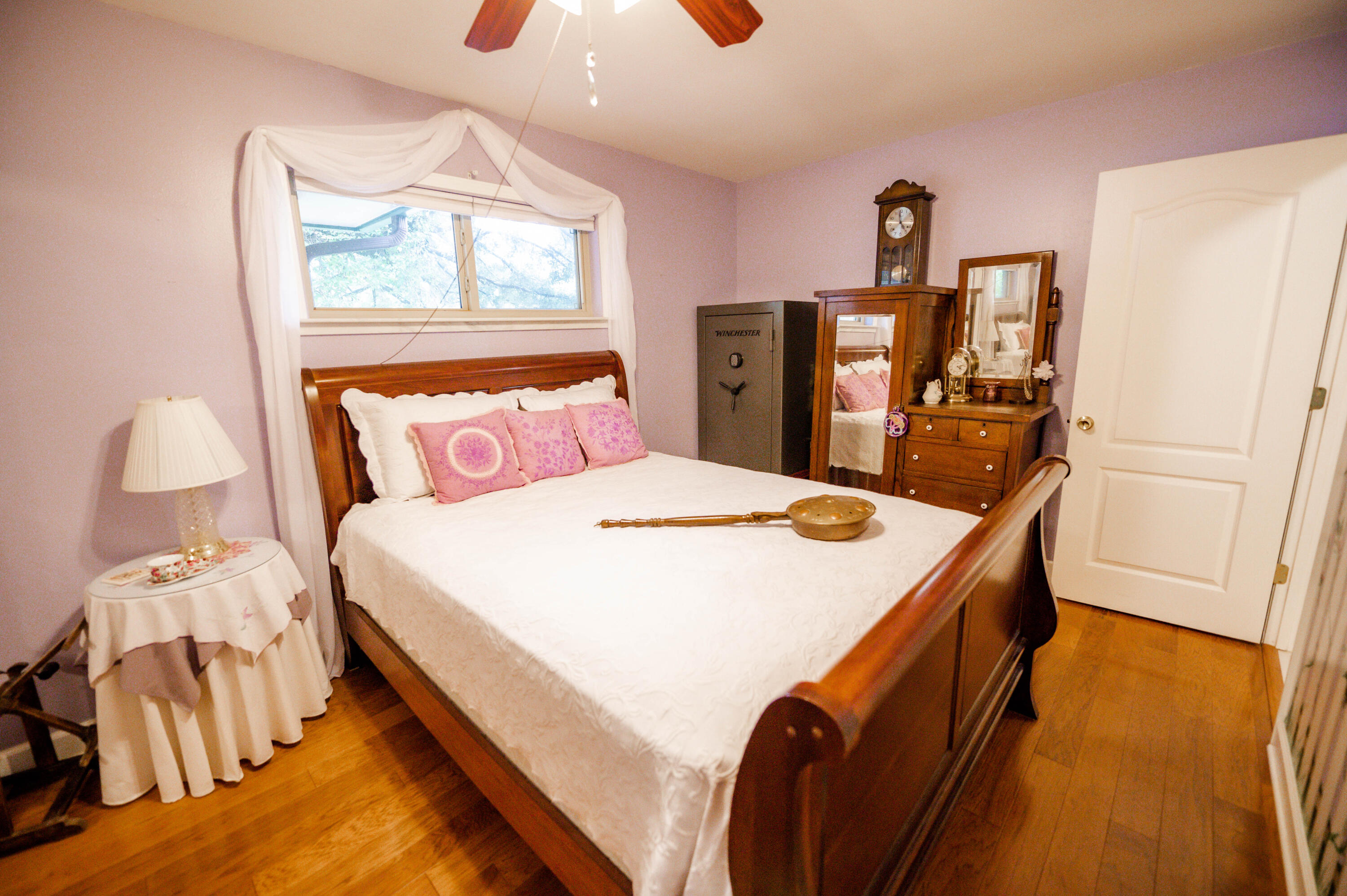 218 Howard Street Niceville, FL 32578 - Photo 19 of 36 a bedroom with a bed and a large mirror on the dresser