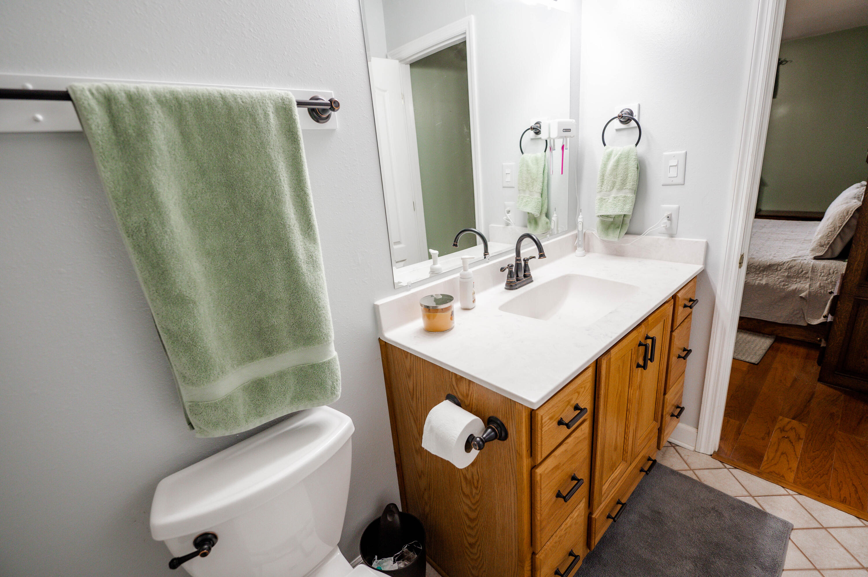 218 Howard Street Niceville, FL 32578 - Photo 25 of 36 a bathroom with a sink a toilet and mirror