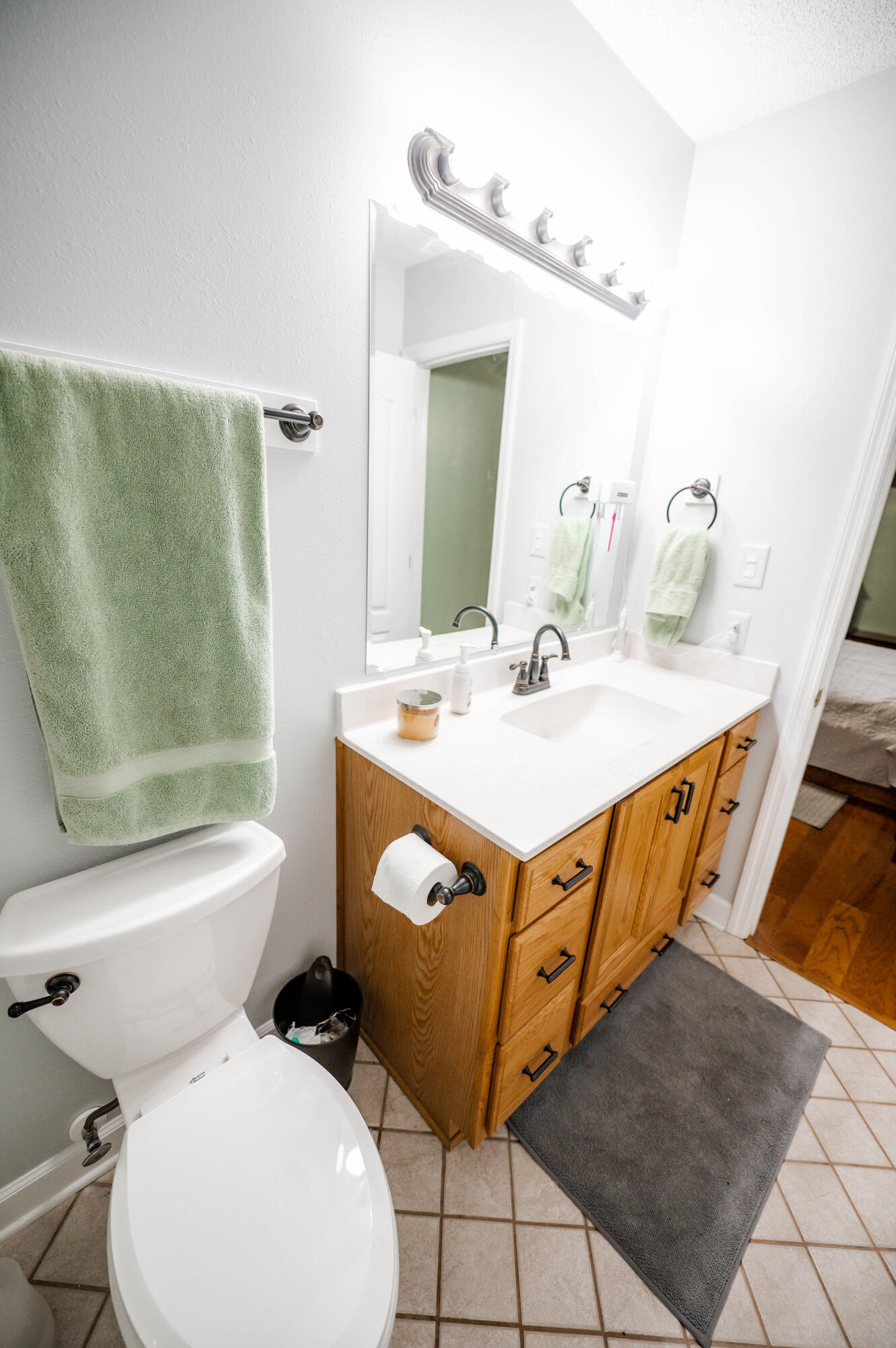 218 Howard Street Niceville, FL 32578 - Photo 26 of 36 a bathroom with a toilet sink and mirror