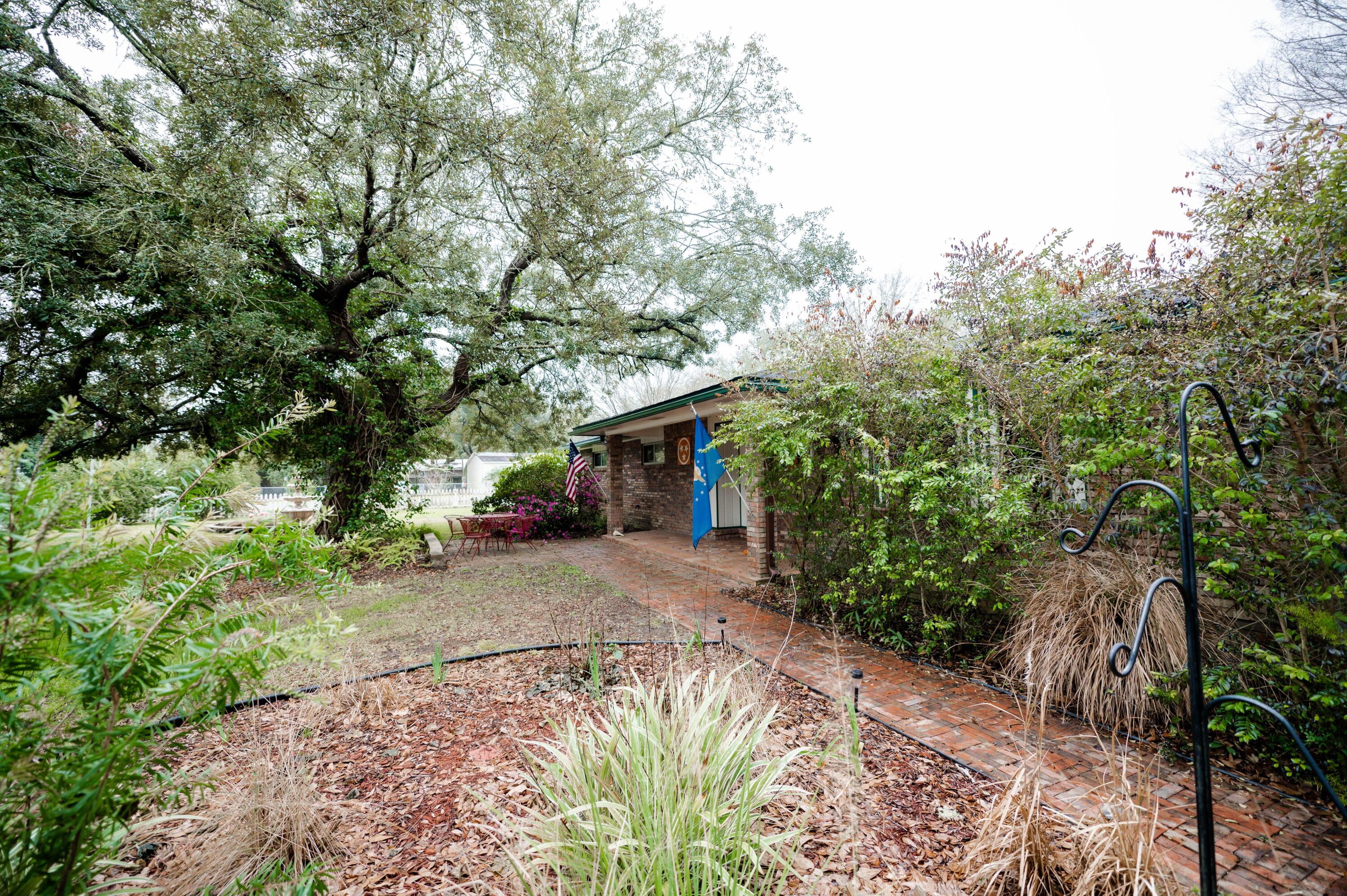218 Howard Street Niceville, FL 32578 - Photo 36 of 36 a view of a house with a tree beside it