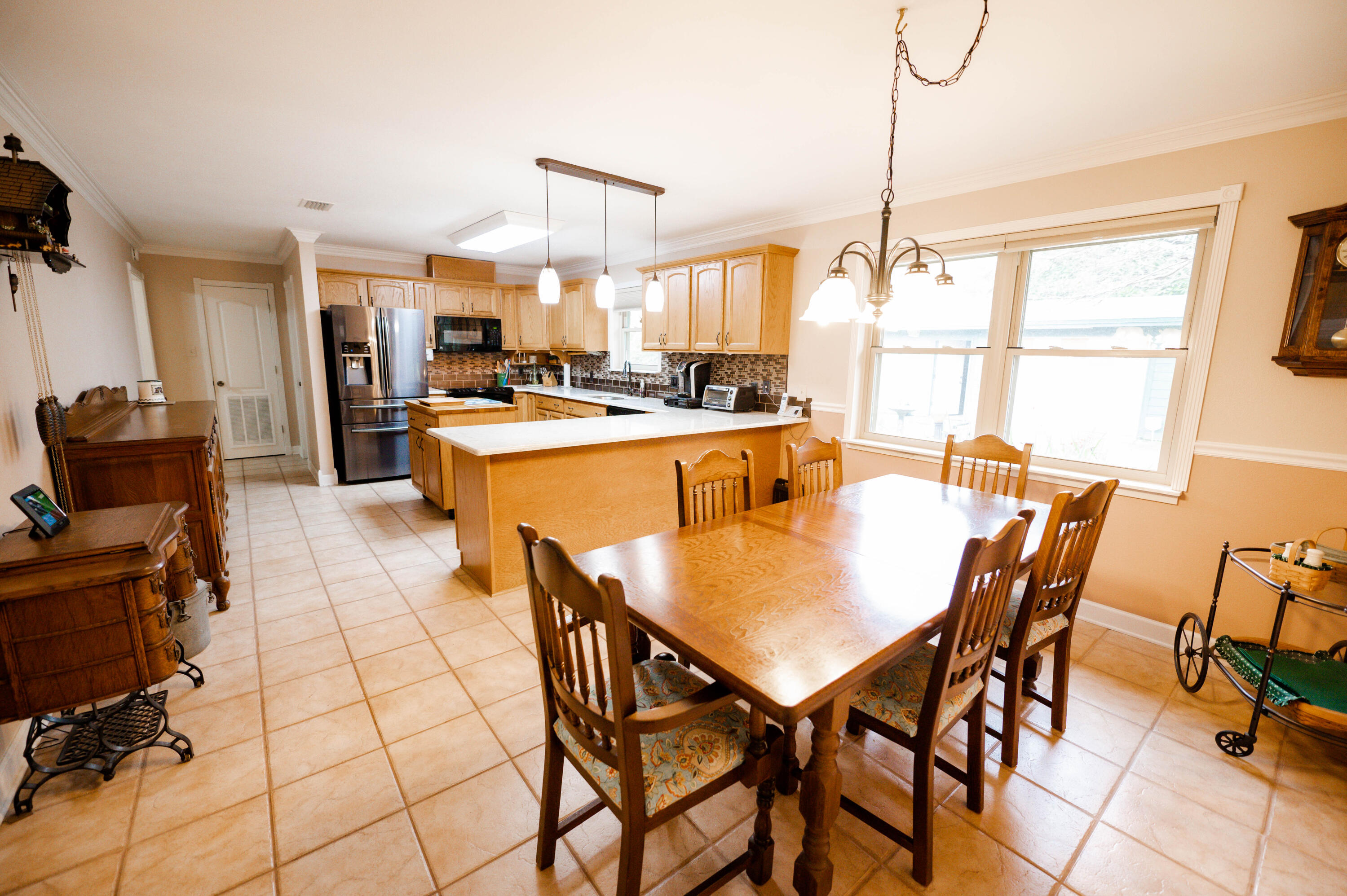 218 Howard Street Niceville, FL 32578 - Photo 10 of 36 a large kitchen with a table and chairs