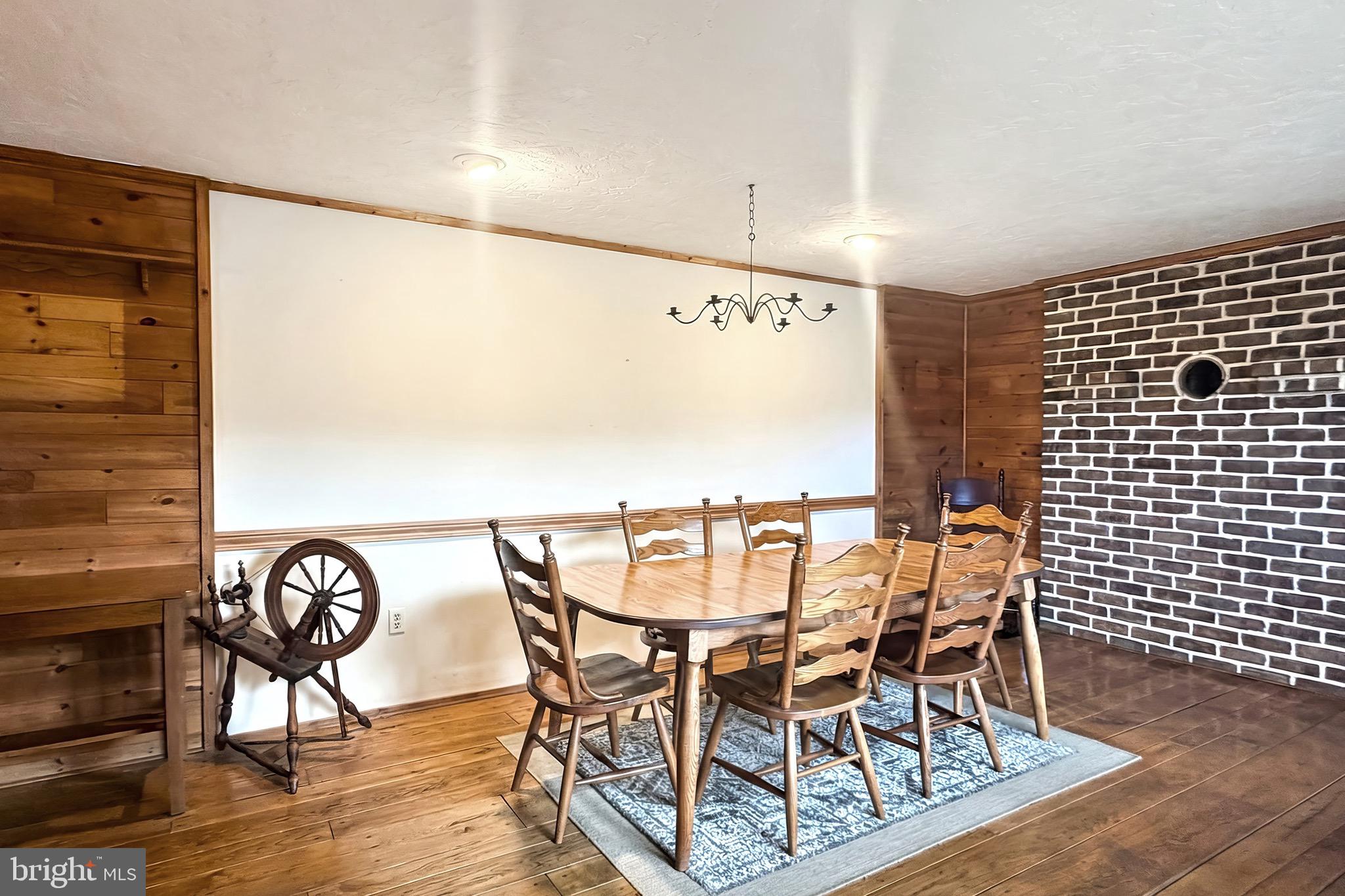 625 Mt Tabor Road Gardners, PA 17324 - Photo 13 of 63 a view of a dining room with furniture and wooden floor