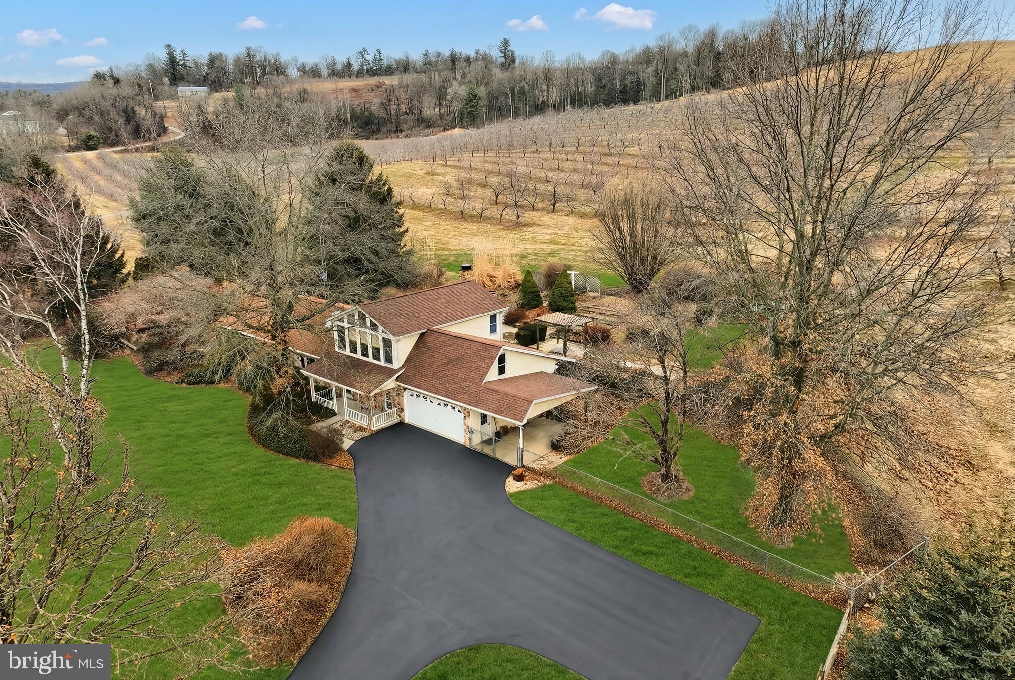 625 Mt Tabor Road Gardners, PA 17324 - Photo 3 of 63 a view of a lake with couches and wooden fence