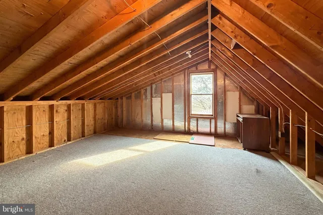 a utility room with cabinets washer and dryer
