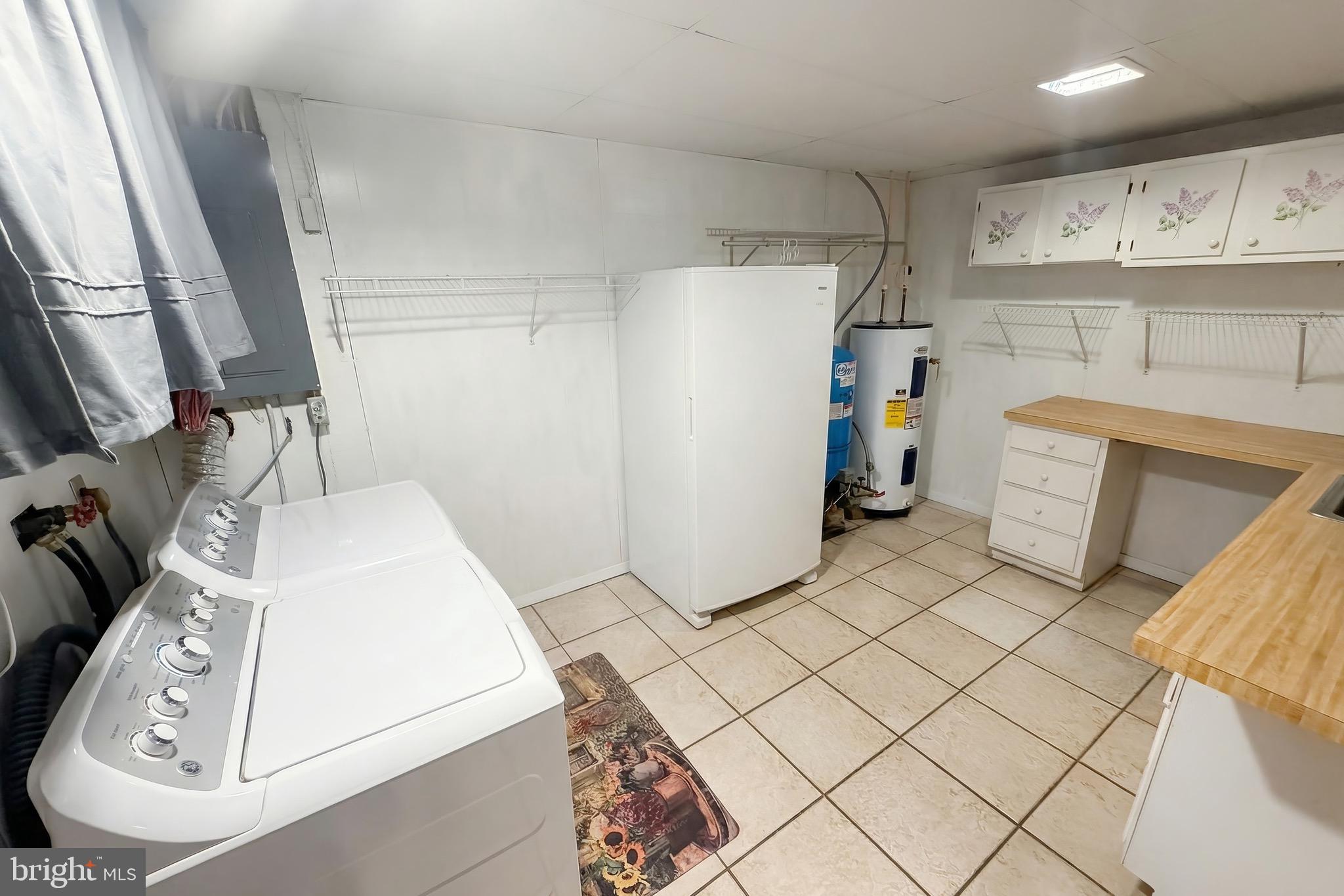 625 Mt Tabor Road Gardners, PA 17324 - Photo 36 of 63 a utility room with cabinets washer and dryer