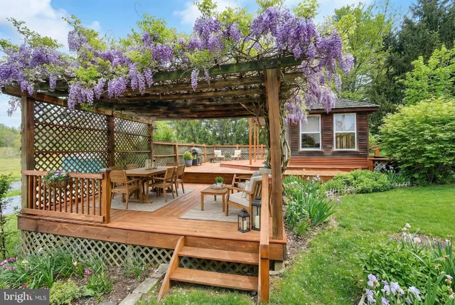 a view of a patio with table and chairs and potted plants