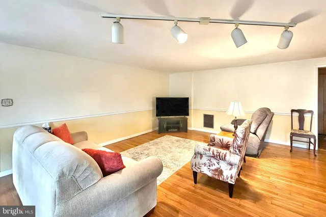 a view of a livingroom with furniture and a window