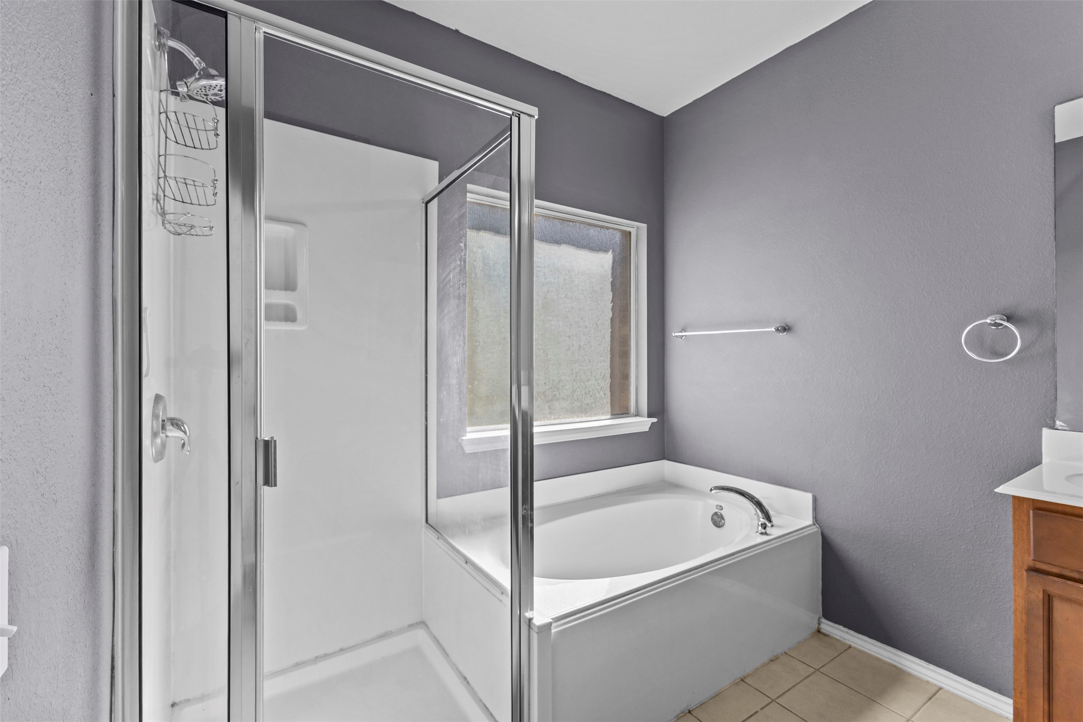 5709 Zachary Scott Street Austin, TX 78747 - Photo 14 of 29 a bathroom with a bathtub and shower