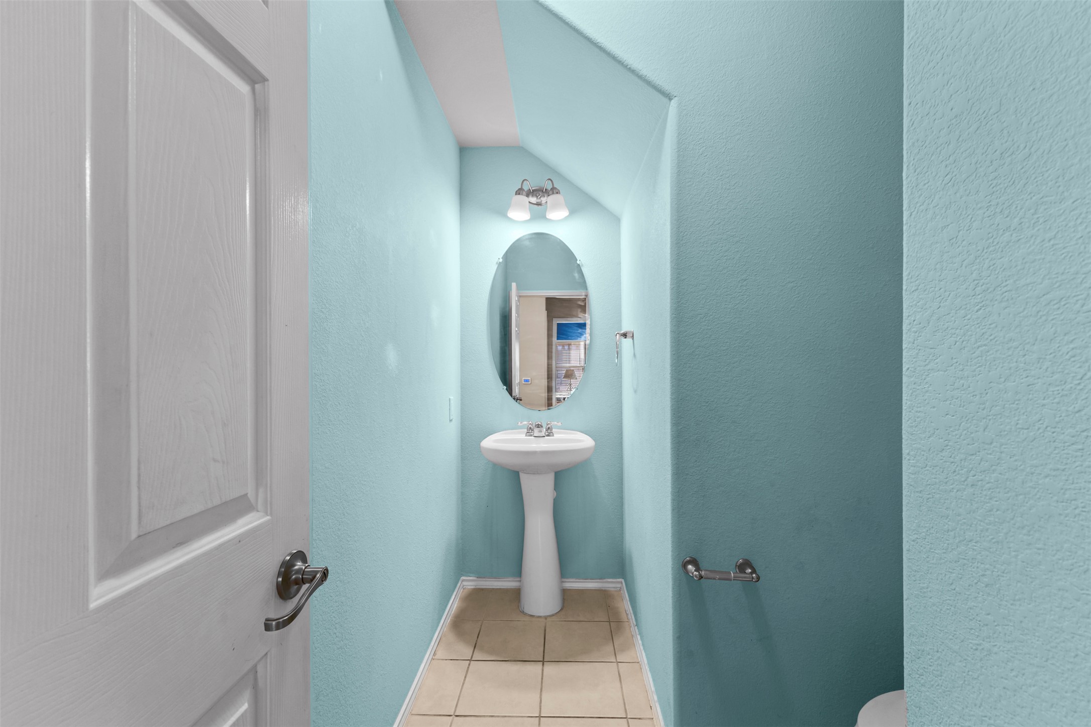 5709 Zachary Scott Street Austin, TX 78747 - Photo 16 of 29 a bathroom with a sink and a mirror
