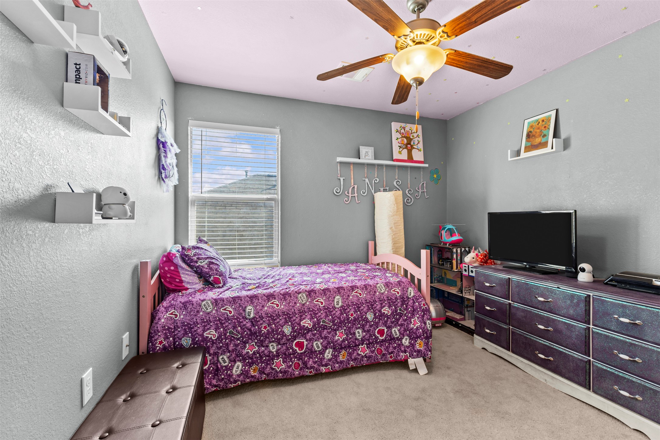 5709 Zachary Scott Street Austin, TX 78747 - Photo 21 of 29 a bedroom with a bed and a flat screen tv