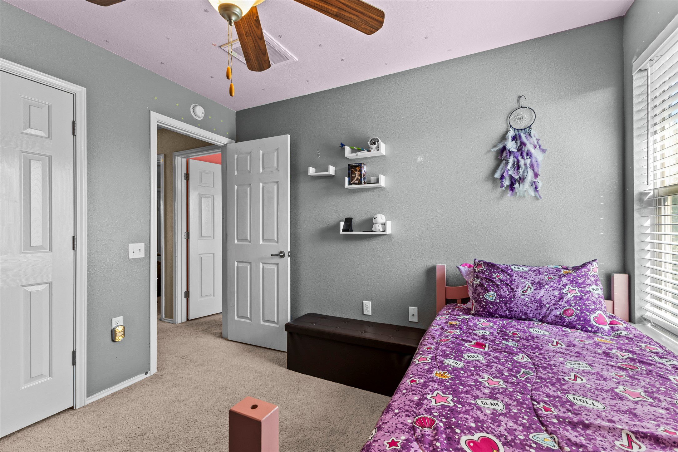 5709 Zachary Scott Street Austin, TX 78747 - Photo 23 of 29 a bedroom with a bed and cabinets
