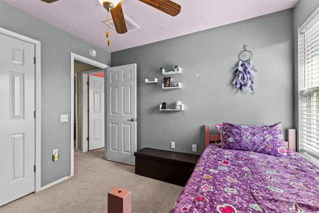 a bedroom with a bed and cabinets