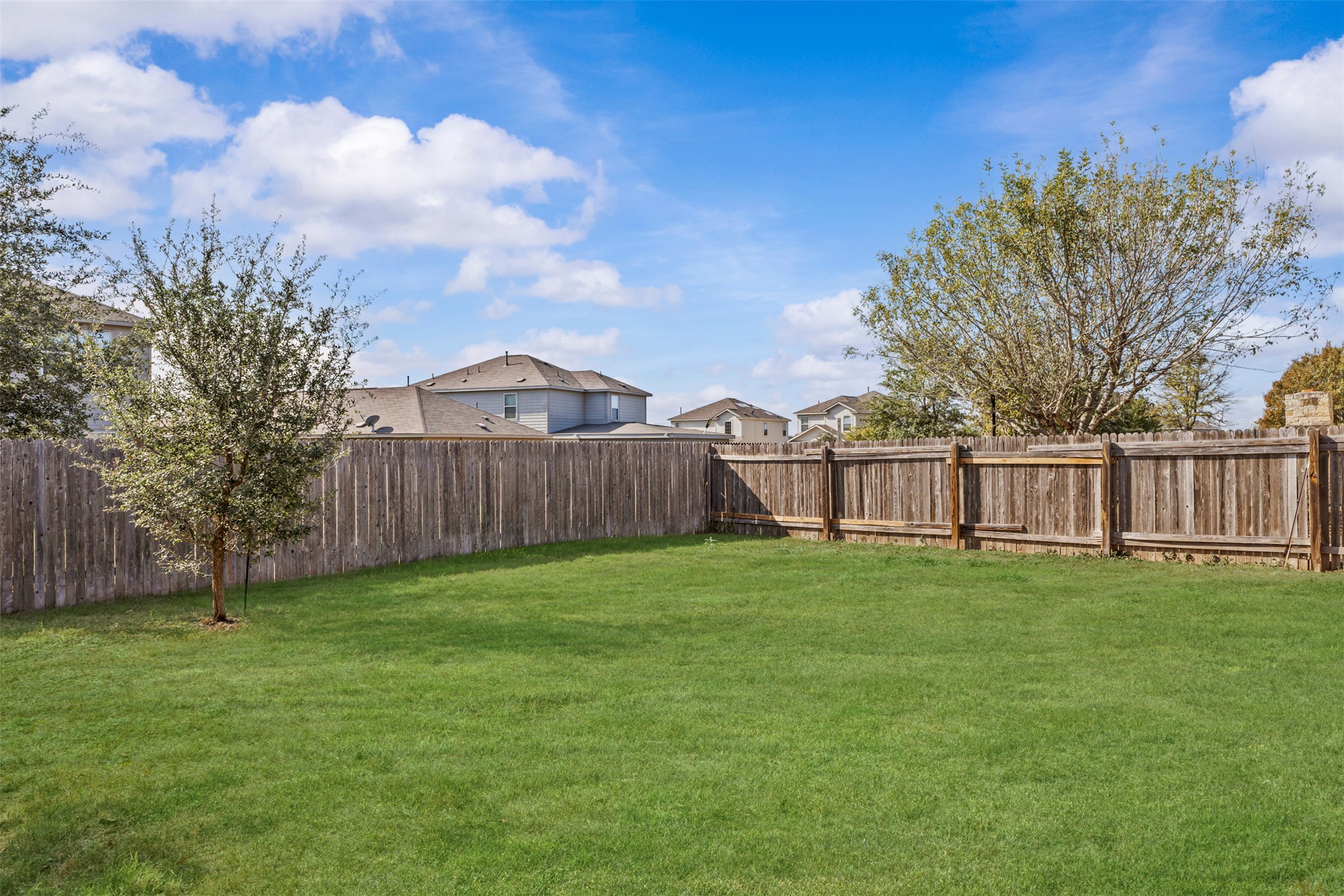 5709 Zachary Scott Street Austin, TX 78747 - Photo 29 of 29 a view of a yard in front of a house with wooden fence